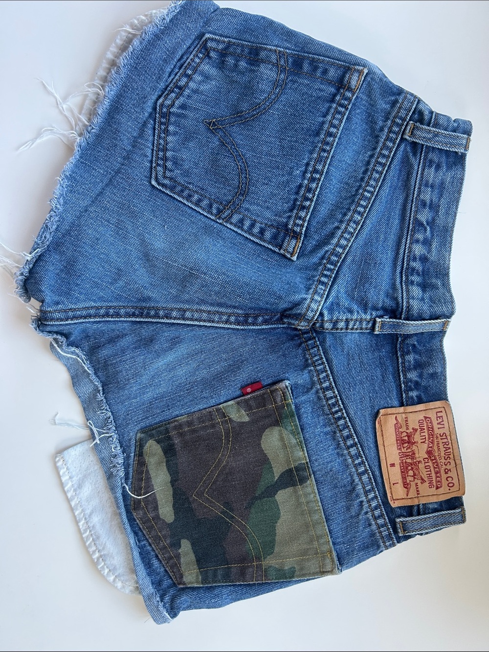 Levi's Blue Denim Cutoff Shorts with Green Camo Pocket